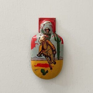 Vintage Tin Lithograph Cowboy On Horse Toy Metal Clicker Noisemaker